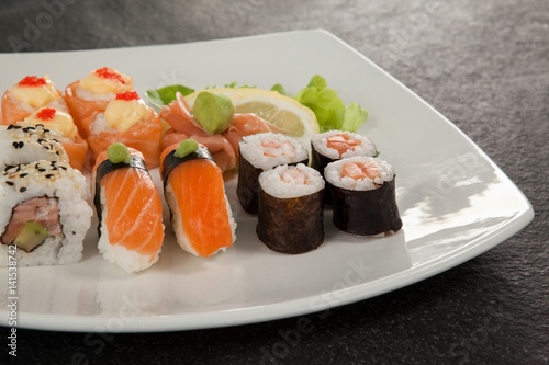 Set of assorted sushi served in a white plate
