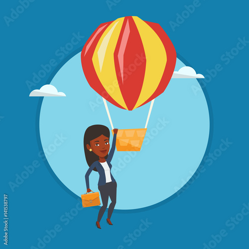 Business woman hanging on balloon.