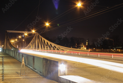 Long bridge in Ceske Budejovice with traffic in night scene. Long exposure. Close up photo