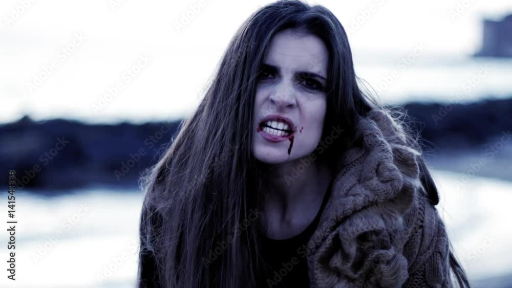 Angry female vampire looking camera at sunrise Angry female vampire looking camera at sunrise