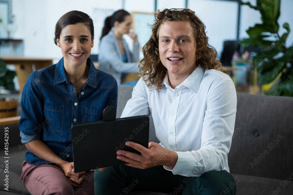 Portrait of smiling business colleagues discussing Portrait of smiling business colleagues discussing