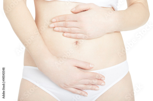 Young woman with hands on belly for abdominal pain isolated on white, clipping path