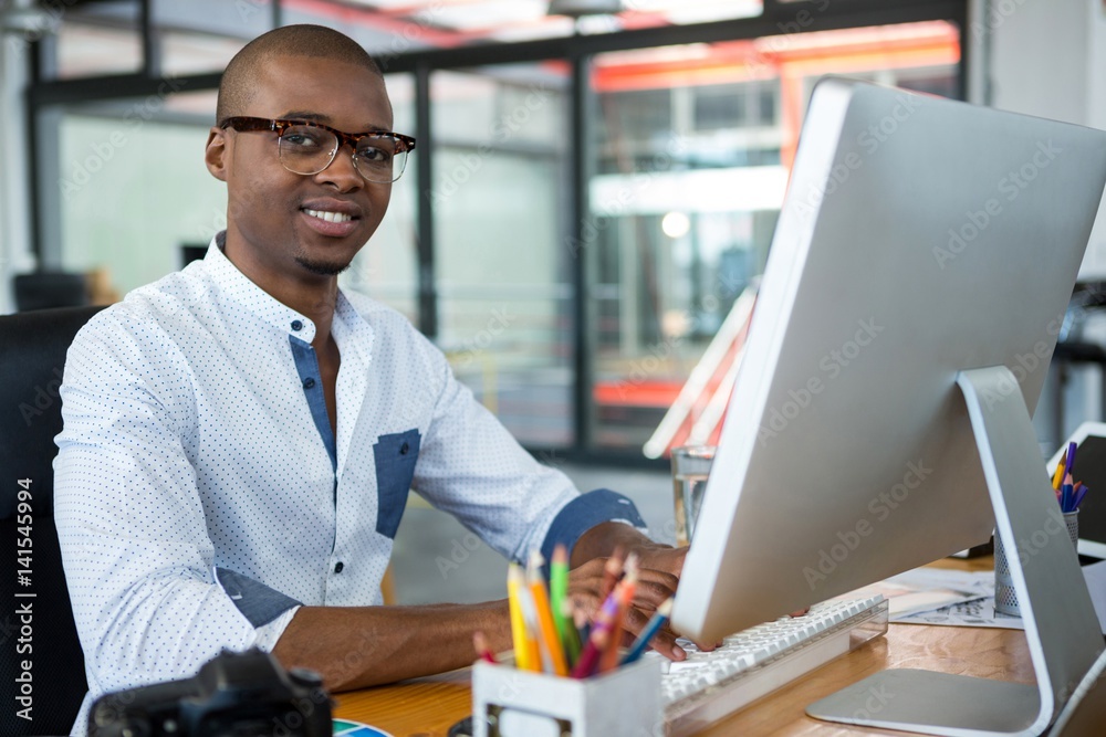 Fototapeta premium Graphic designer working at desk