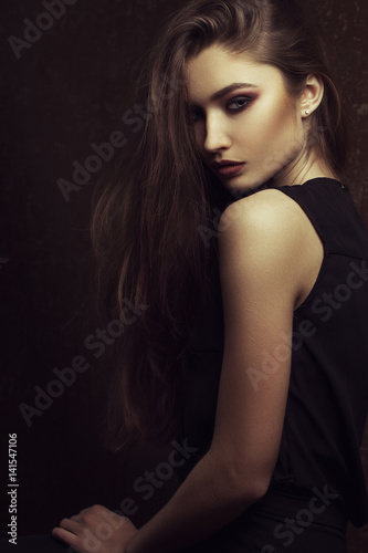 fashion portrait of elegant woman with perfect provocative make up. Studio shot