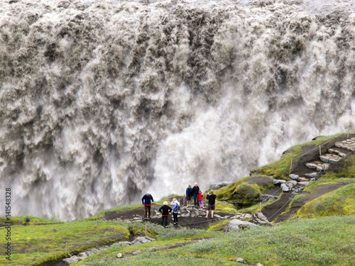 Iceland - Tourists at waterfall