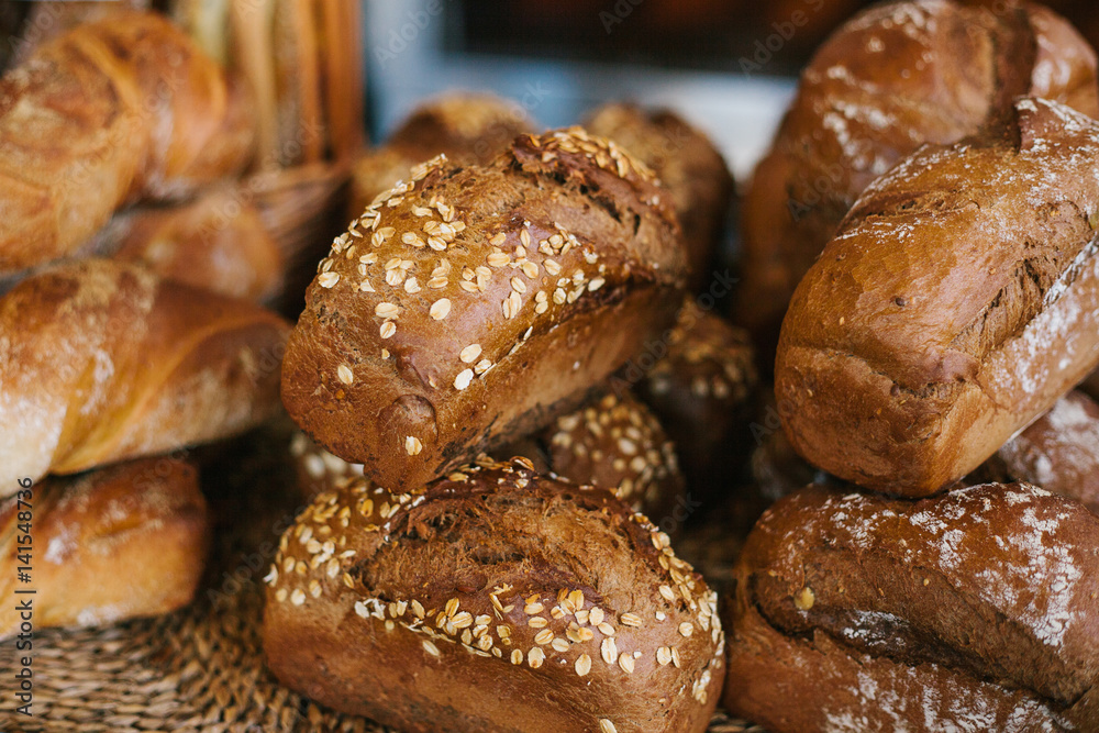 Fresh bread from cereals with seeds from a bakery. Healthy and nutritious food. The product contains carbohydrates.