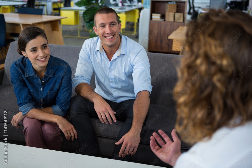 Business executives interacting each other