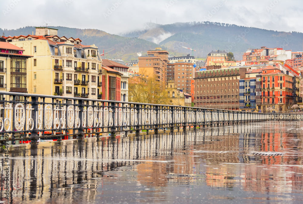 Fototapeta premium colorful old facades of Bilbao city on cloudy day. Spain