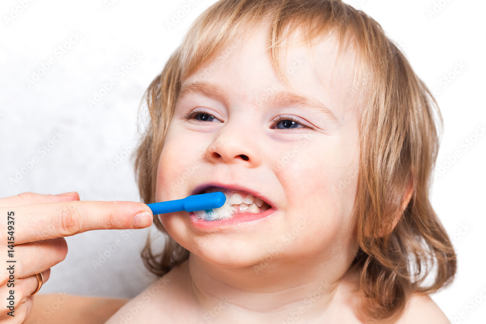 Mom brush cleans teeth funny blond kid 2 years Mom brush cleans teeth funny blond kid 2 years