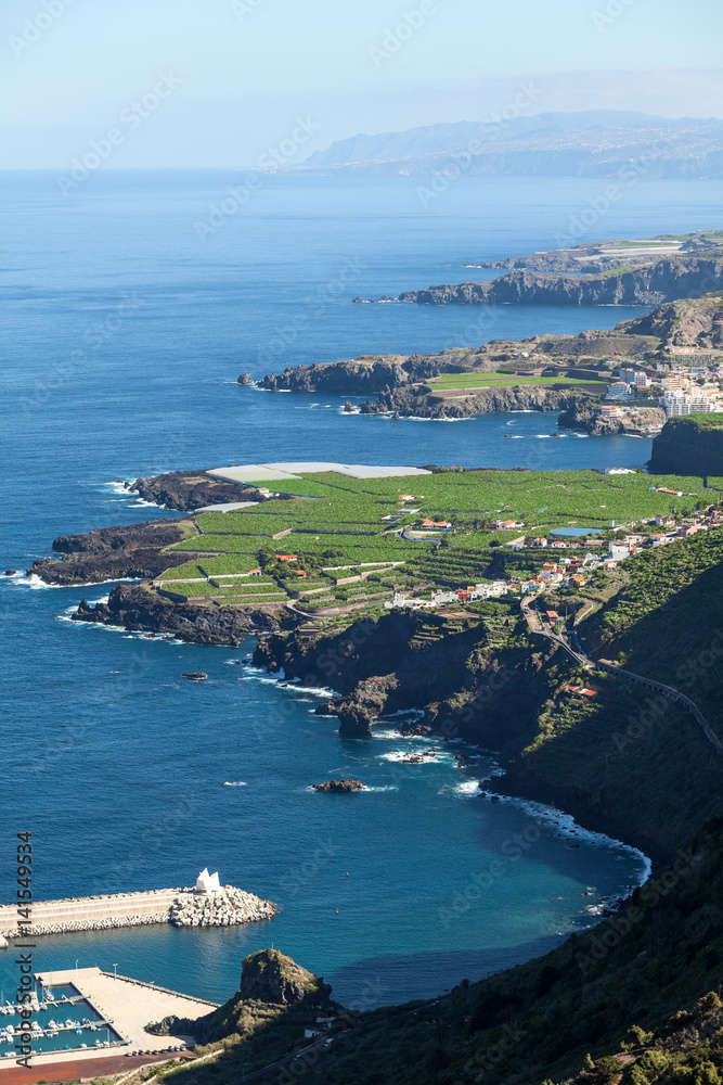 Shoreline of northern part of Tenerife island with blue Atlantic ocean. Aerial view at green bananas plantations. The Canary, Spain, Europe