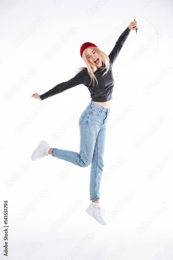 Full length portrait of a cheerful casual young woman