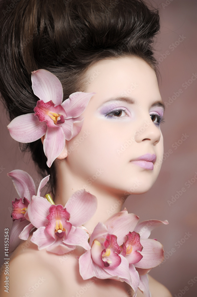 Young girl with pink flowers Young girl with pink flowers