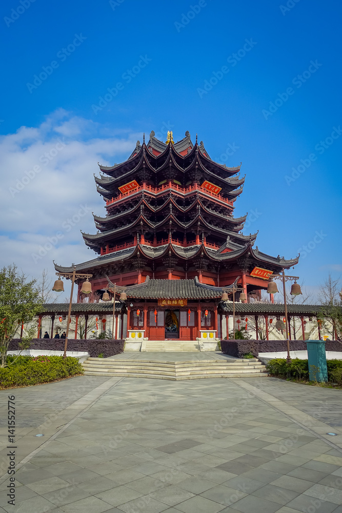 CHONGYUANG TEMPLE, CHINA - 29 JANUARY, 2017: Beautiful red and black tower with stunning chinese architecture, seen from medium distance on a nice sunny day