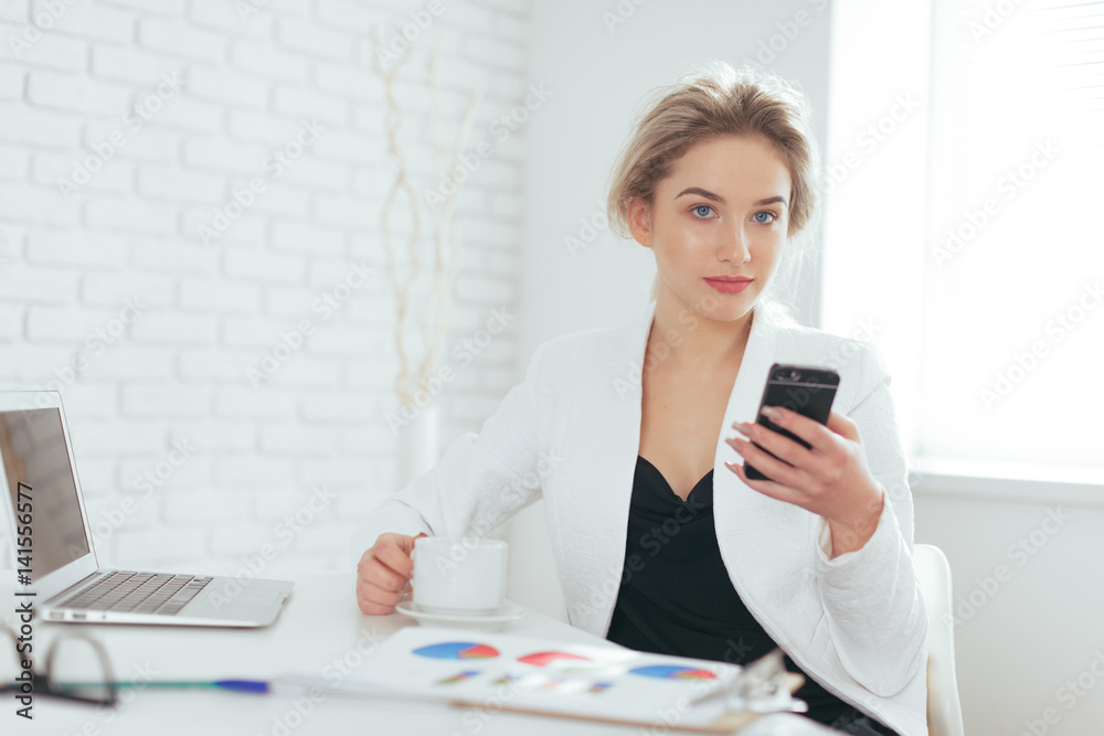 Portrait of beautiful young woman working in the office. Portrait of beautiful young woman working in the office.