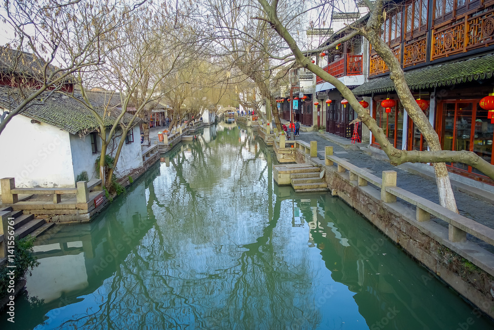 SHANGHAI, CHINA - 29 JANUARY, 2017: Famous Zhouzhuang water town, ancient city district with channels and old buildings, charming popular tourist area