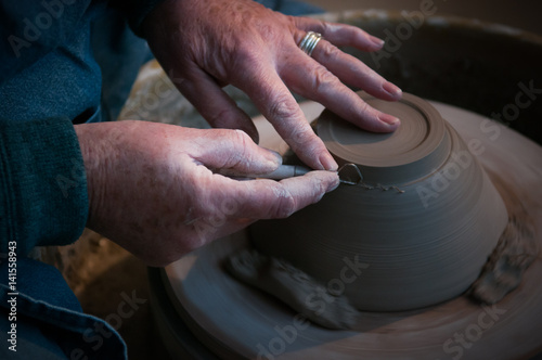 Fotótapéta womans hands creating pottery objects in a ceramics workshop