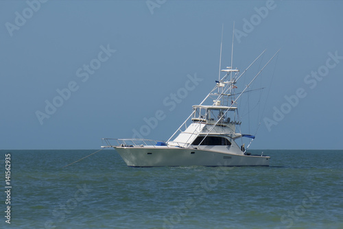 A pleasure boat anchors off of St. Pete Beach, Florida on a warm sunny January afternoon.