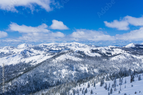 Snow covered slopes of the Sierra Nevada mountains in Lake Tahoe near a ski resort in winter