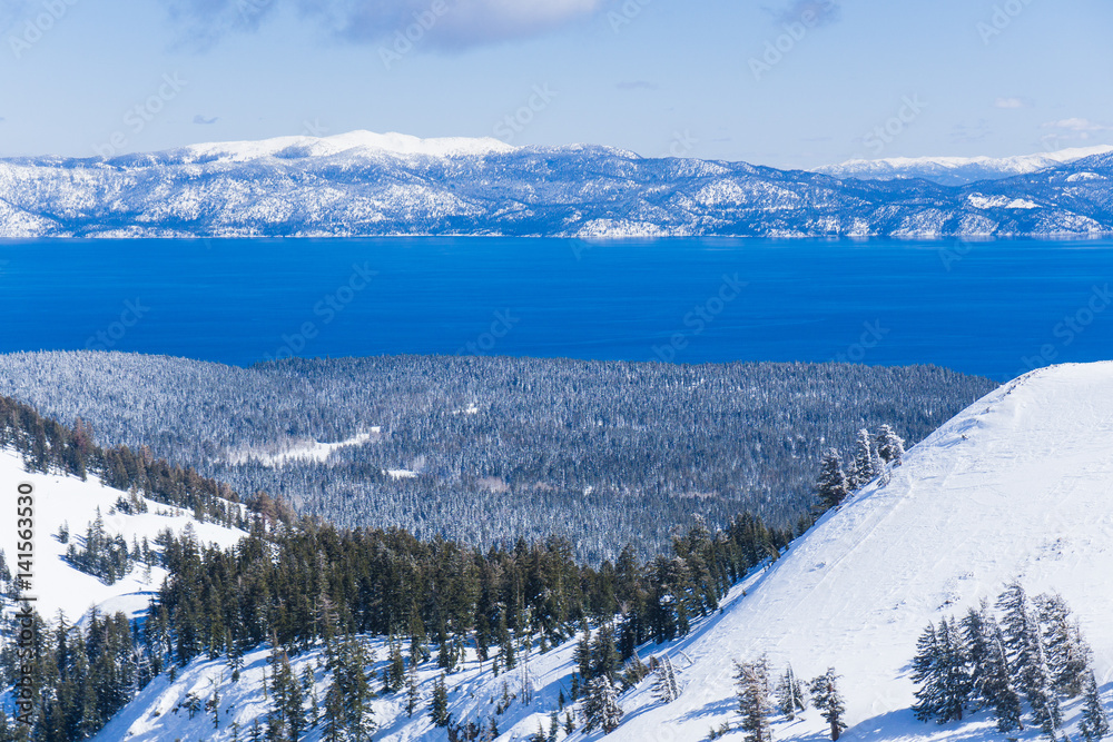 Snow covered slopes of the Sierra Nevada mountains above Lake Tahoe California near a ski resort in winter