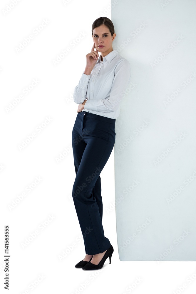 Portrait of businesswoman leaning against wall Portrait of businesswoman leaning against wall