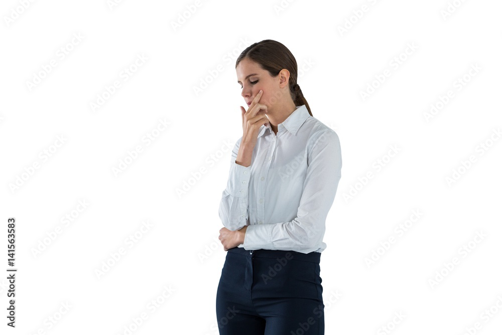 Thoughtful businesswoman standing with hand on face Thoughtful businesswoman standing with hand on face
