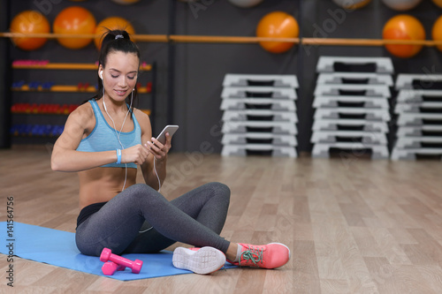 Young woman with fitness tr...
