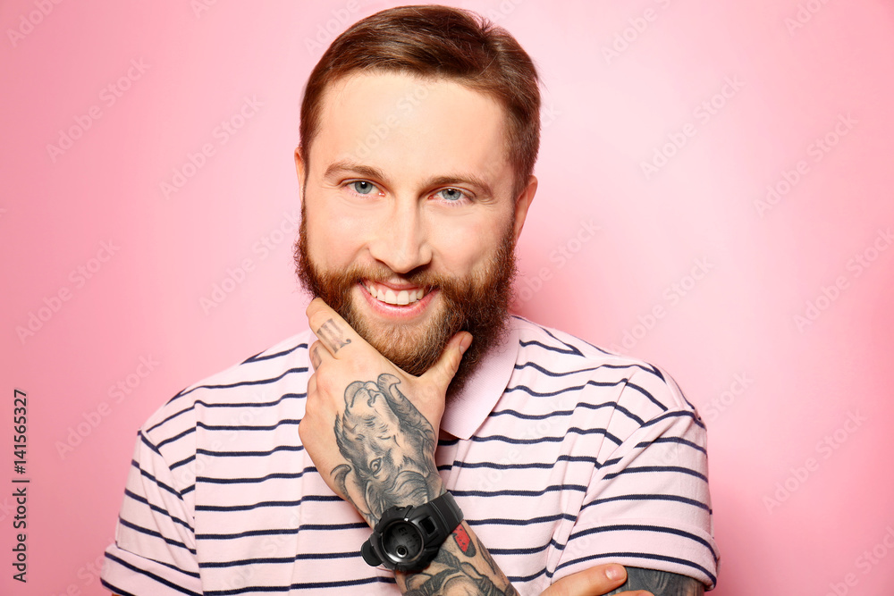 Obraz premium Handsome young man on pink background
