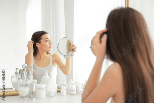 Young woman with hair loss ...