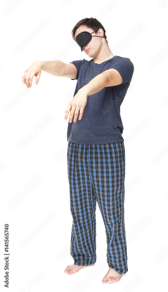 Young sleepy man suffering from somnambulism on white background Young sleepy man suffering from somnambulism on white background