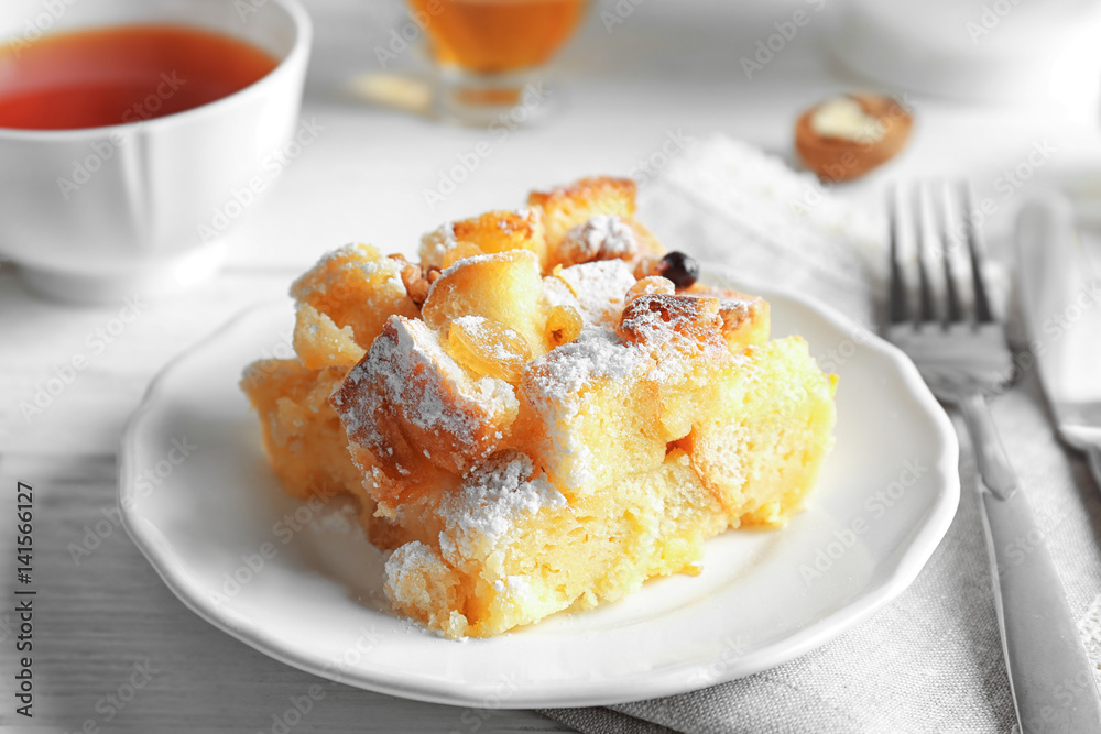 Delicious bread pudding with sugar powder on plate