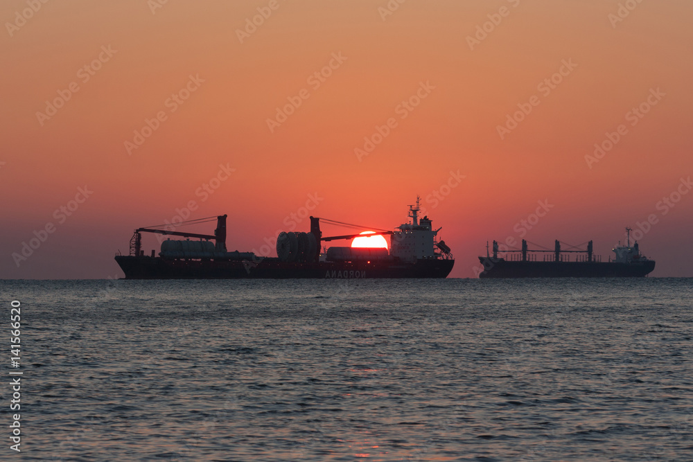 Silhouette of a ship leaving for sailing
