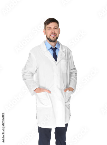 Young handsome pharmacist standing on white background © Africa Studio