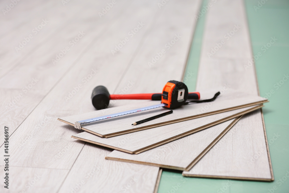 Laminate installing equipment on planks Laminate installing equipment on planks