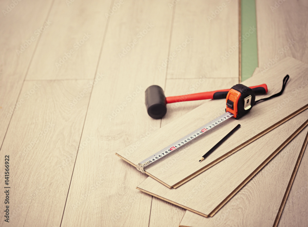 Laminate installing equipment on planks Laminate installing equipment on planks