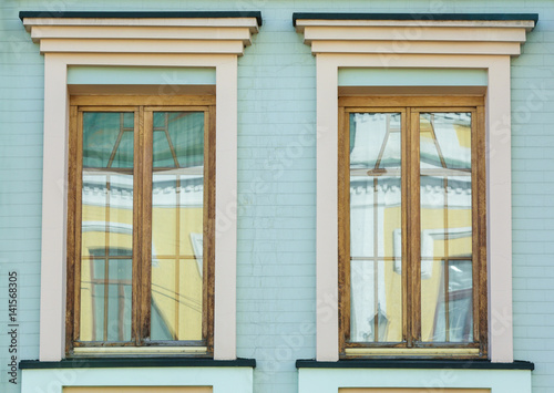 Vintage wooden windows with brick wall background