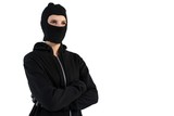 Thoughtful female hacker standing with arms crossed