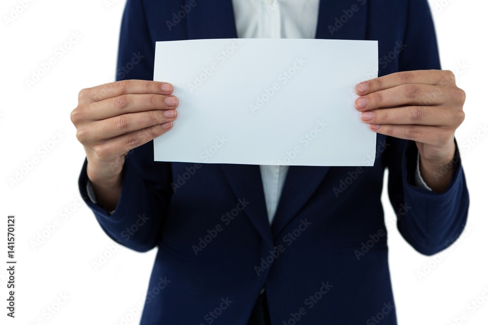 Mid section of businesswoman holding blank a paper Mid section of businesswoman holding blank a paper
