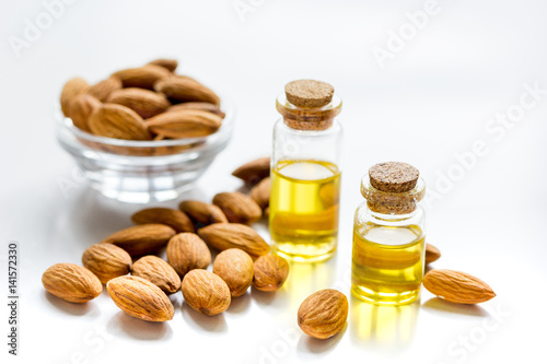 cosmetic and therapeutic almond oil on white background