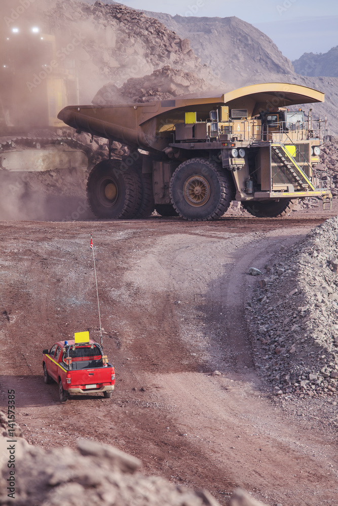 Loading of copper ore on very big dump-body truck Loading of copper ore on very big dump-body truck