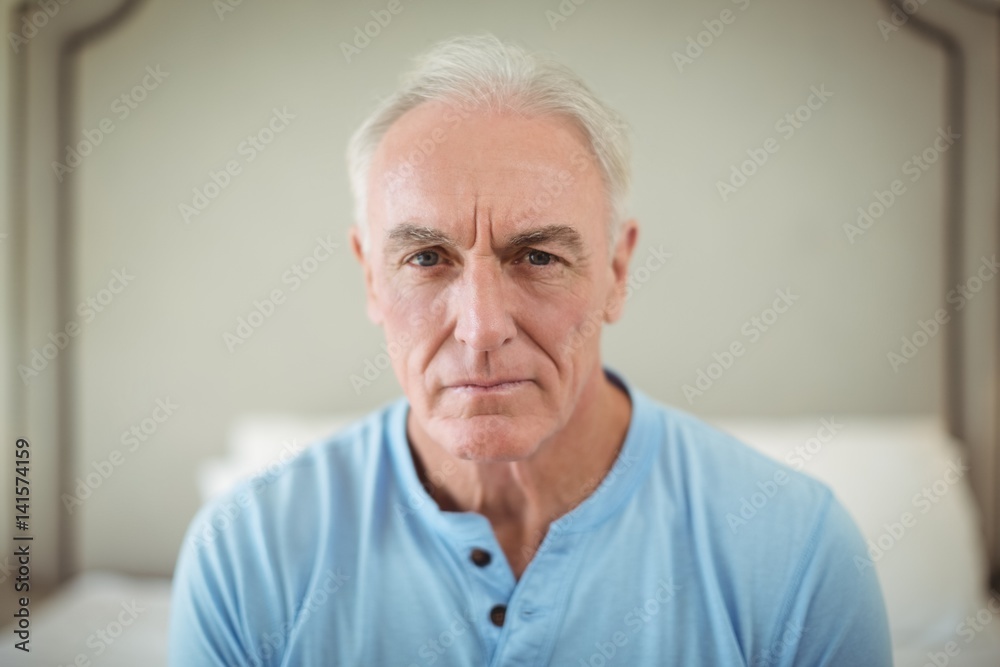 Worried senior man sitting at home Worried senior man sitting at home