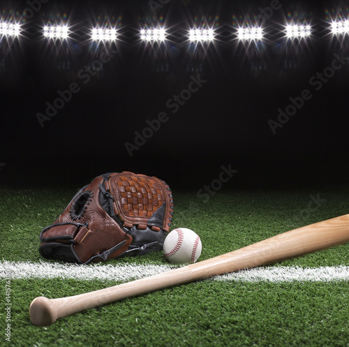 Photography Baseball mitt ball and bat at night under stadium lights