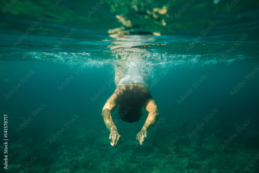 woman swim underwater