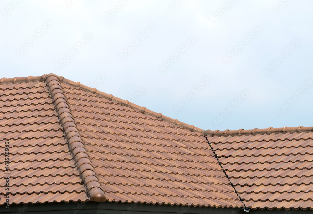 Roof house with tiled roof on blue sky Roof house with tiled roof on blue sky
