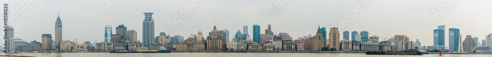 panoramic view of River Boats on the Huangpu River and as Background the Skyline of the Northern Part of Puxi
