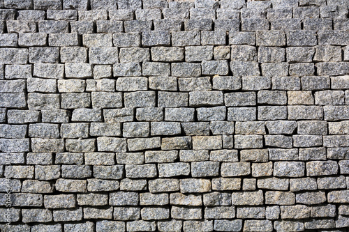 gray bricks wall texture  location - Wellington  New Zealand statue near the Parlament building