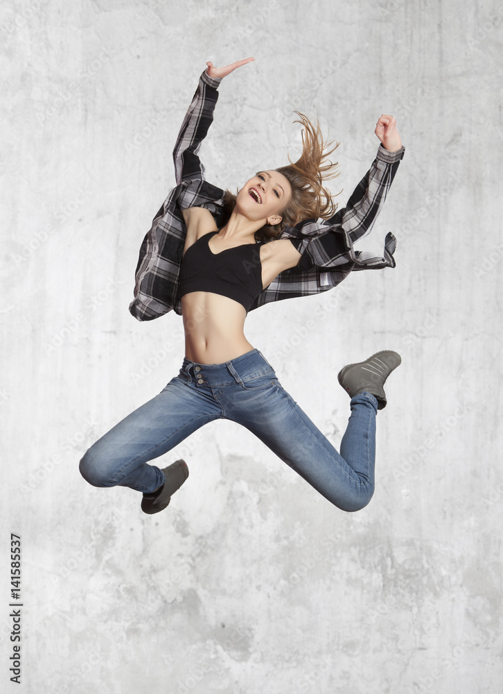 Young casual woman jumping