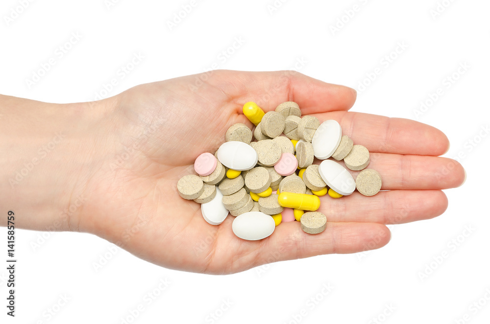 hand of young girl holding pills. hand of young girl holding pills.