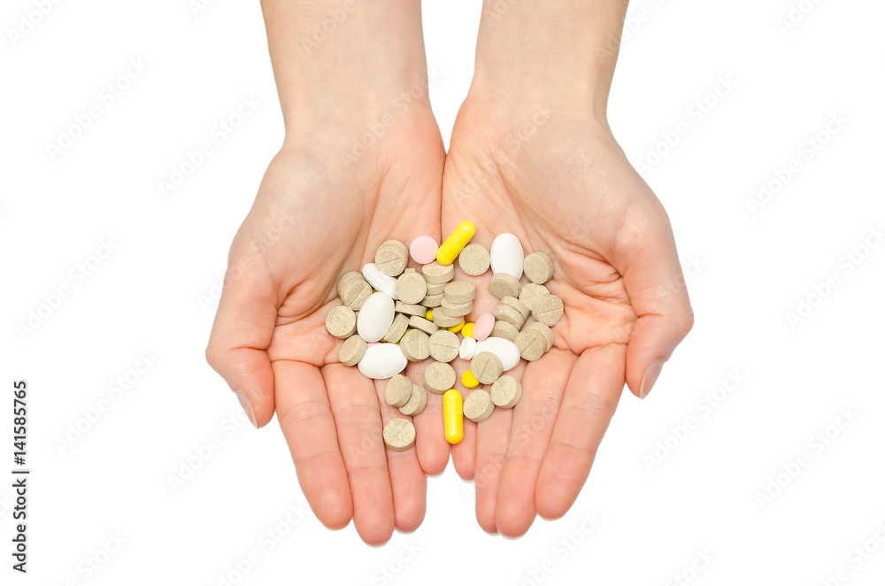 hand of young girl holding pills. hand of young girl holding pills.