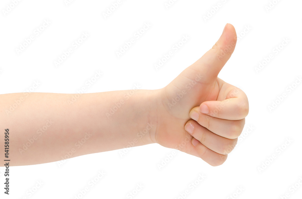 hand of young kid shows thumb up.