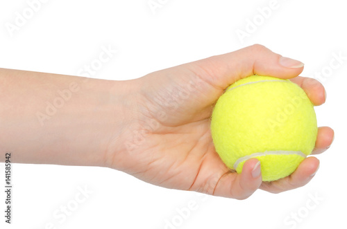 hand of young girl holding tennis ball.